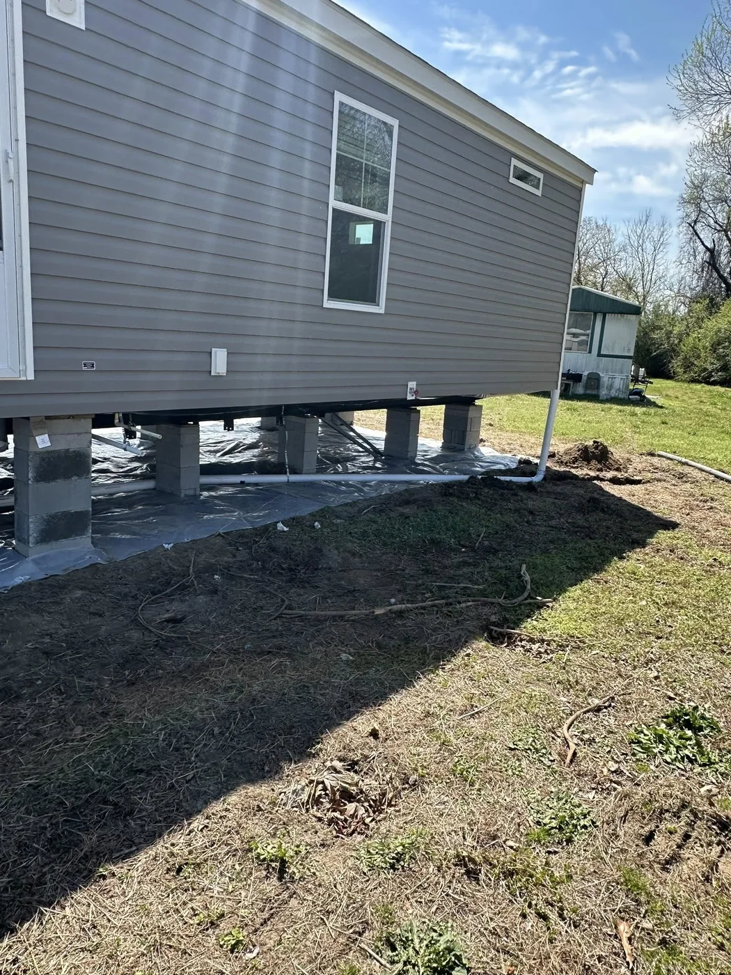 Plumbing inspection work under a Goldsboro area home